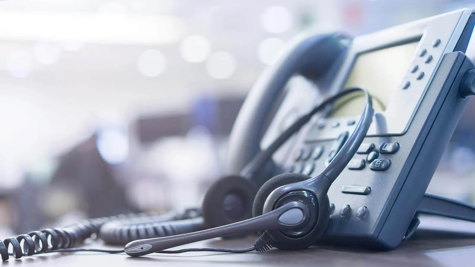 Office desk phone with a headset