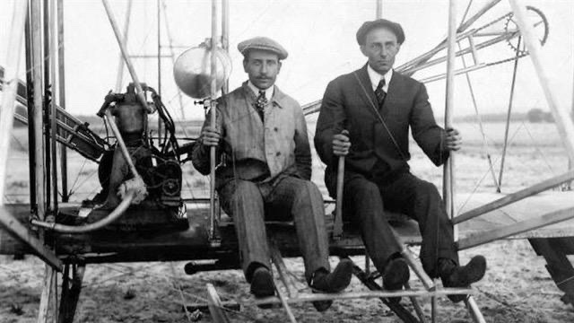 a black and white photo of Wilbur and Orville Wright