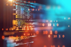 code and binary on a computer screen